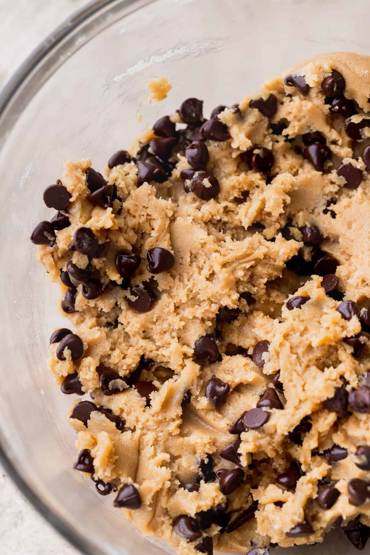 Close up of the cookie dough in a glass bowl.