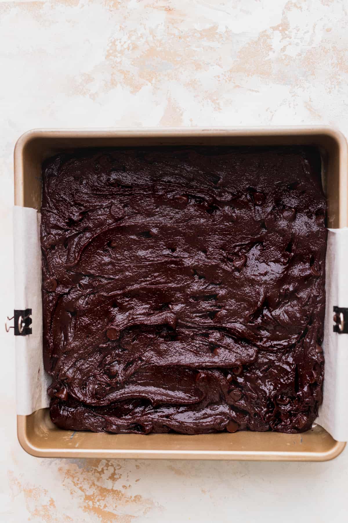 Brownie batter in a tin.