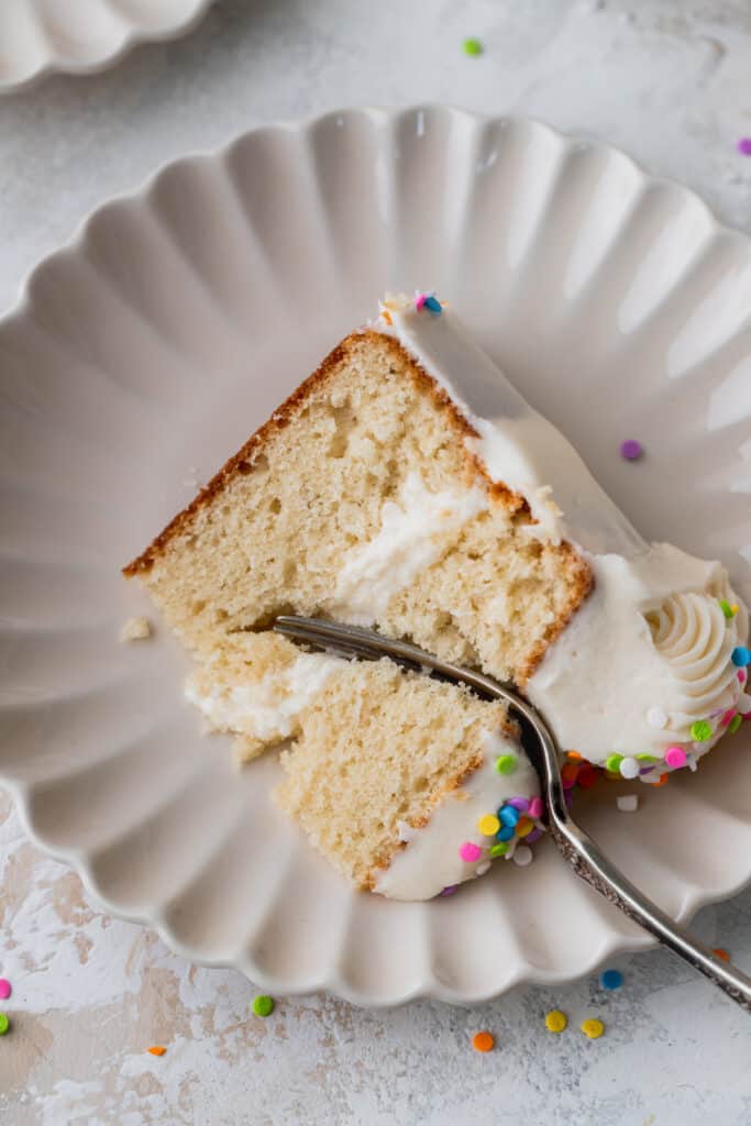 One slice of cake with a fork inserted.