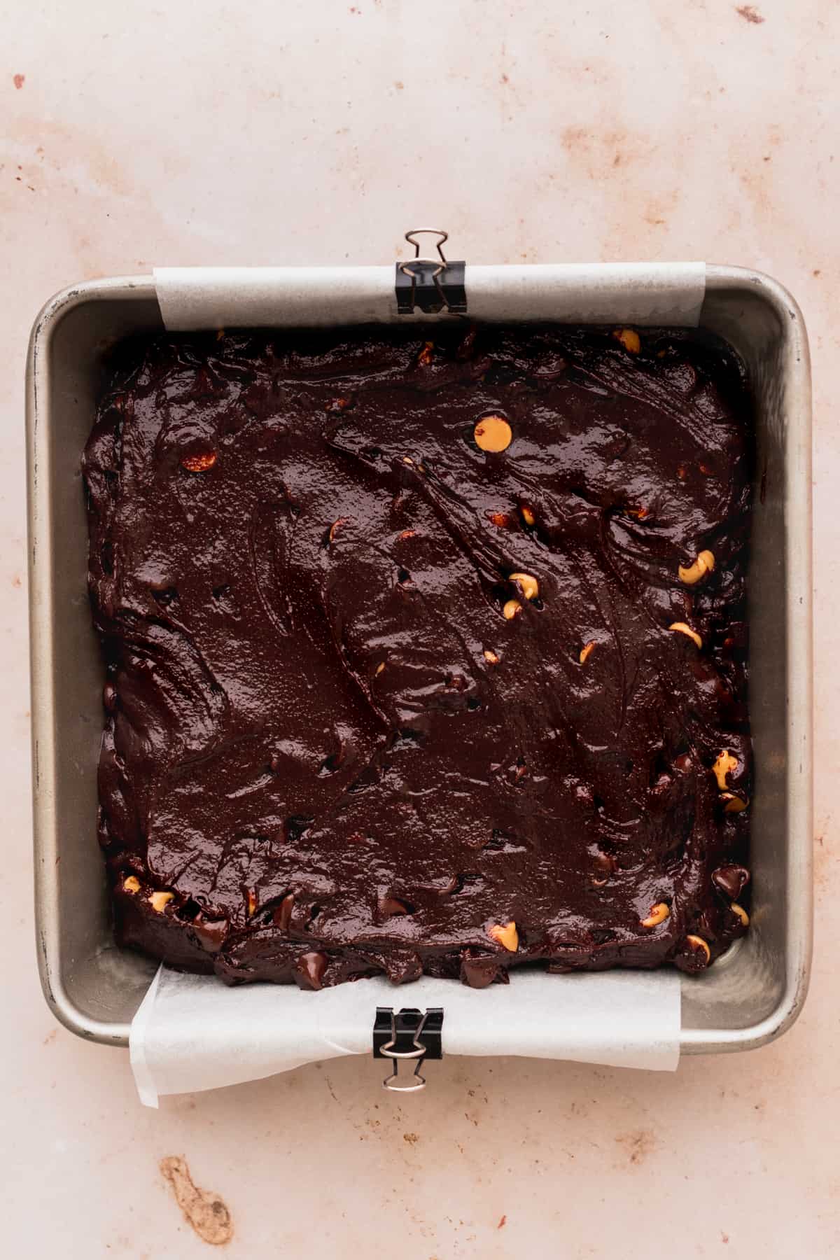 Brownie batter in a pan.