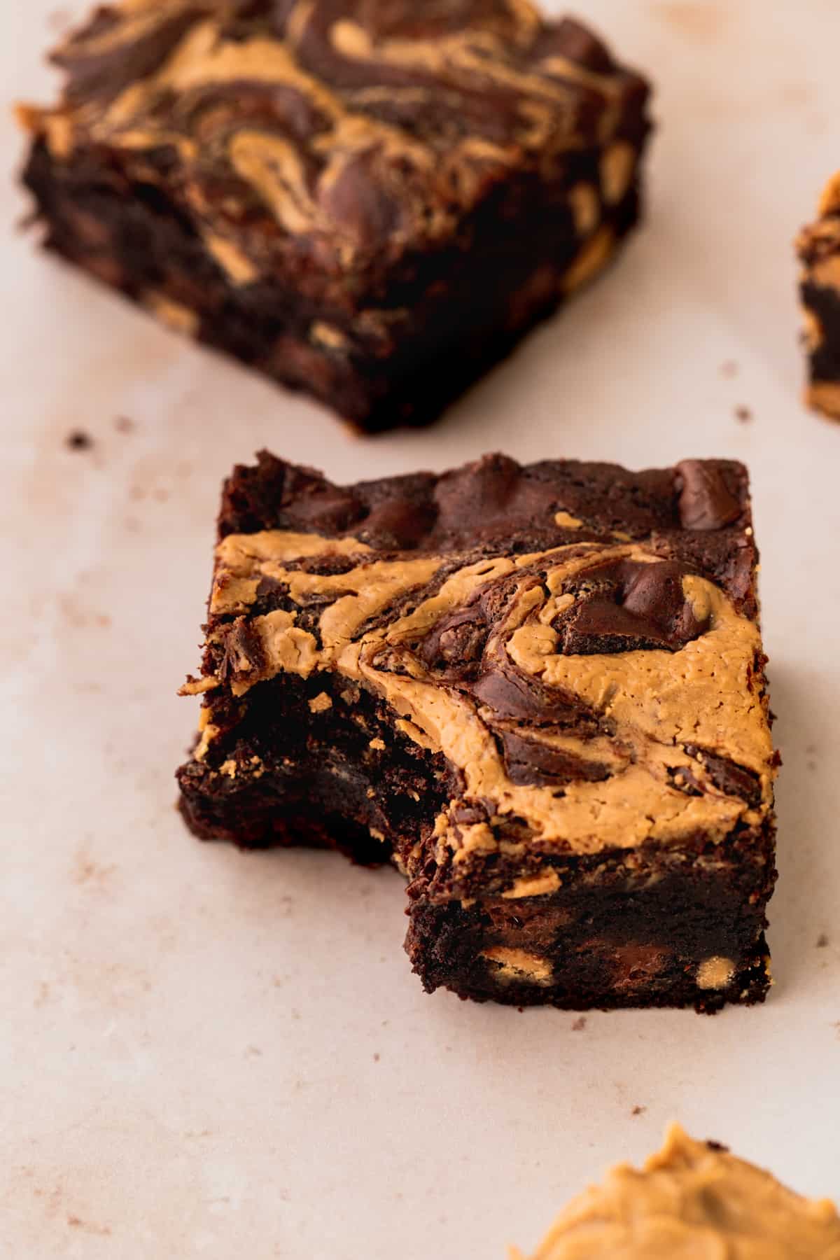 Chocolate peanut butter brownie with a bite missing.