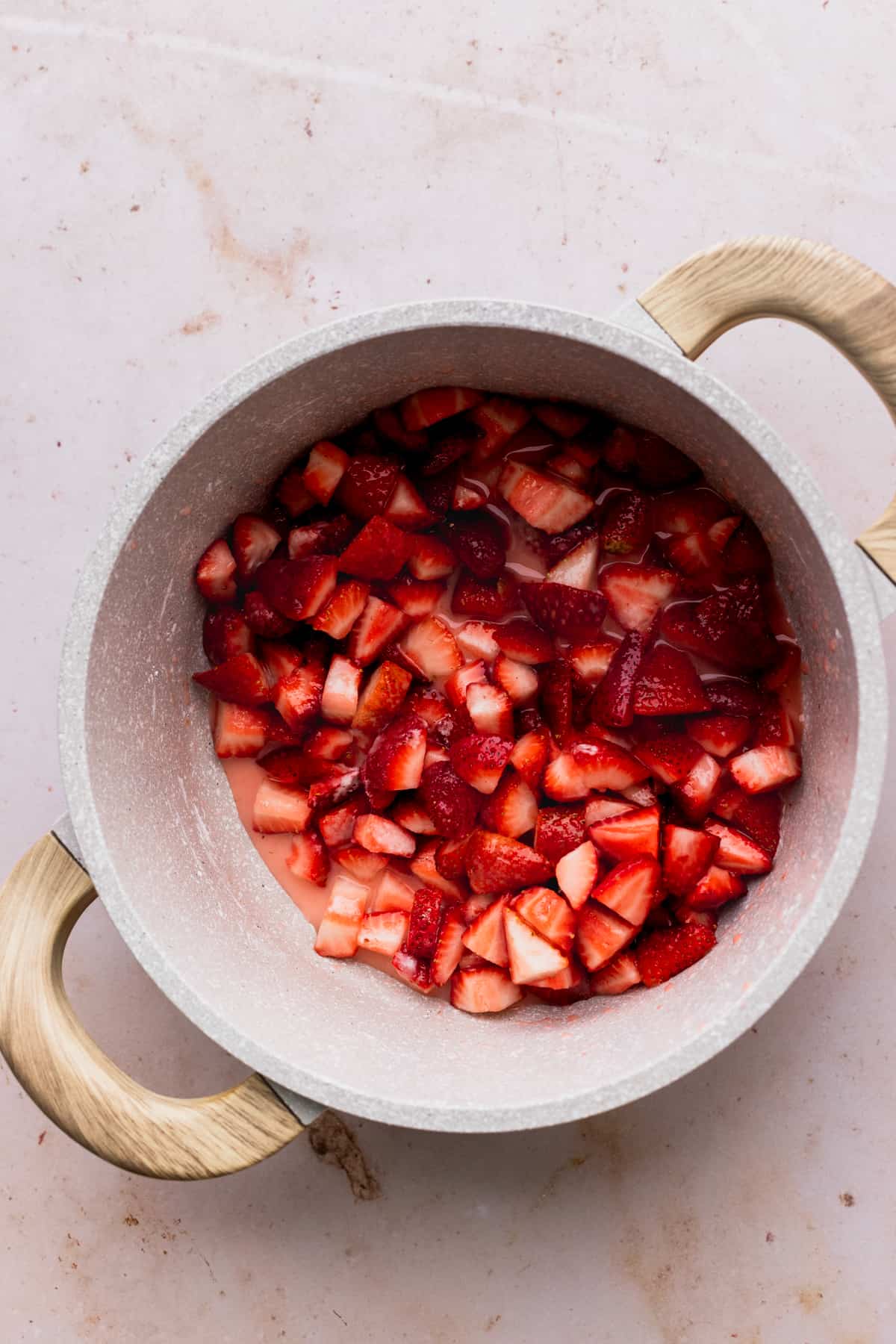 Strawberries in a sauce pan.