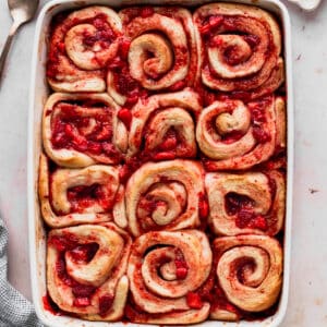 Baked strawberry rolls in a pan.