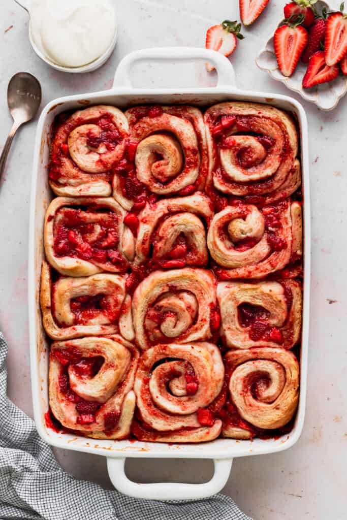 Baked strawberry rolls in a pan.