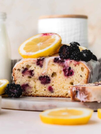 Blackberry lemon bread on a marble board.
