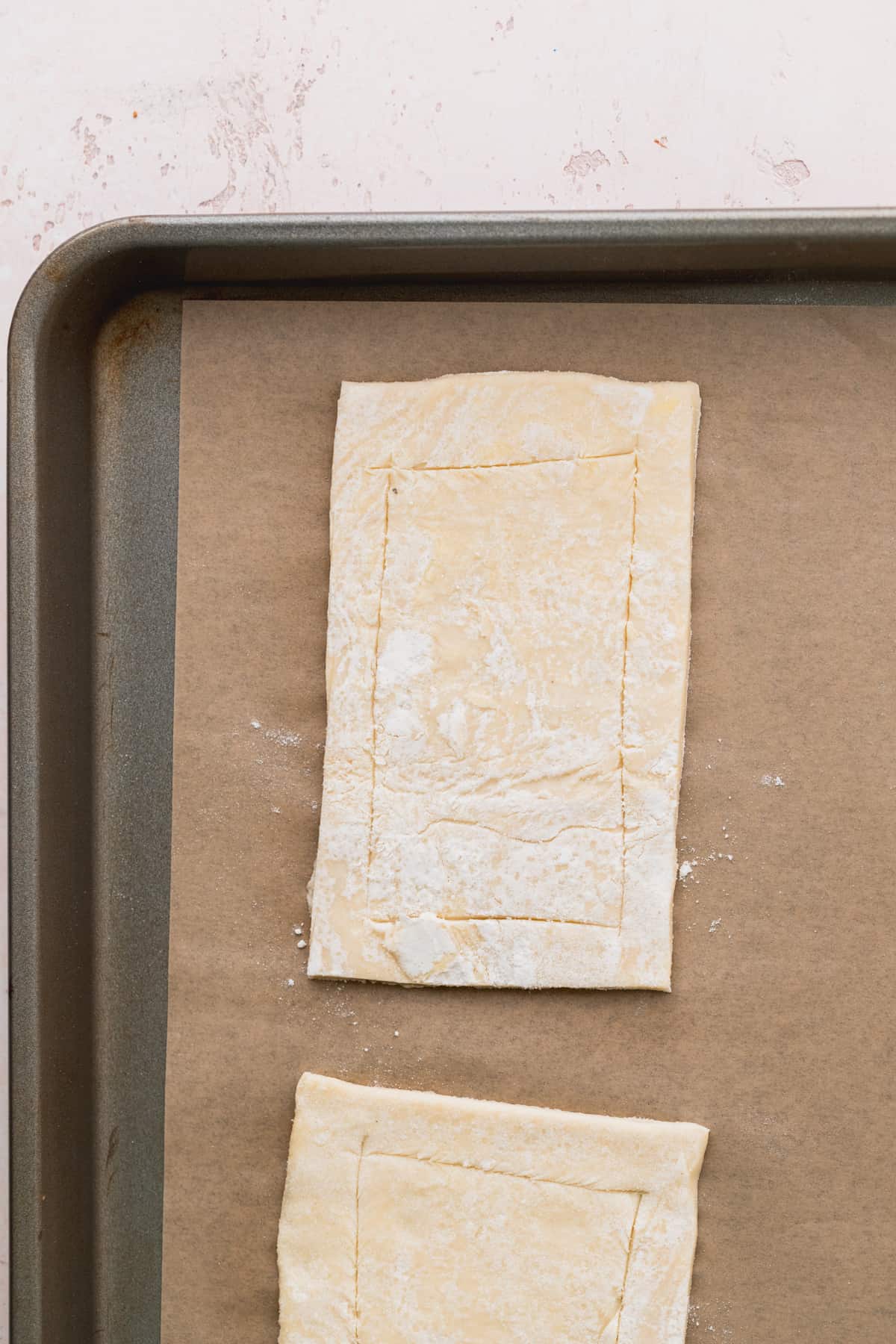 Puff pastry sheet on a cookie sheet.