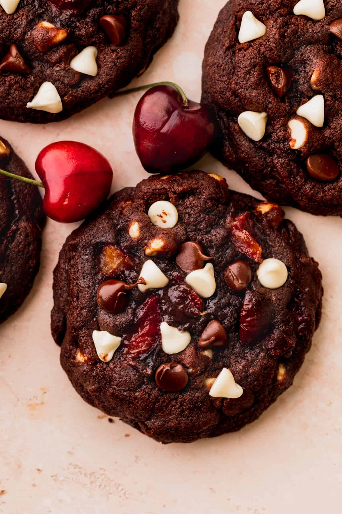 One cookie with baked cherries on top.