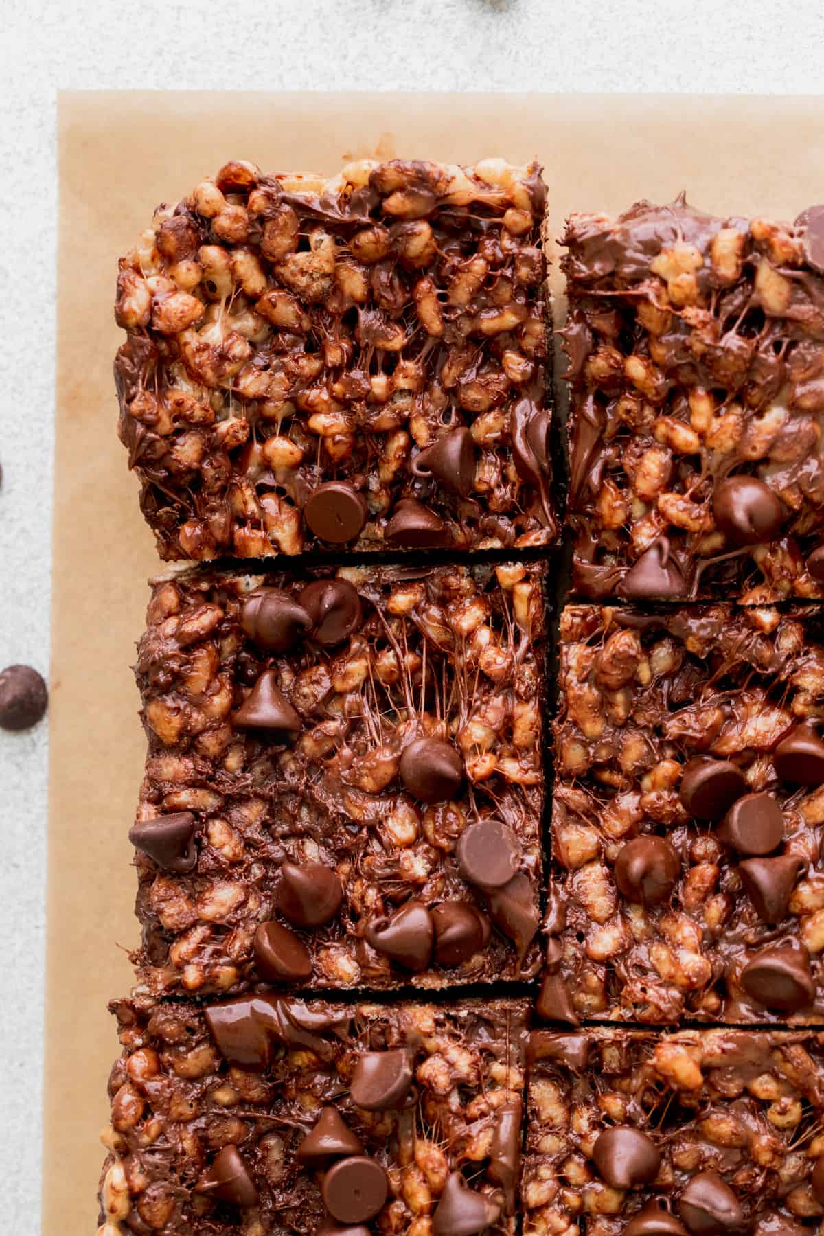 Rice krispie treats on parchment paper.