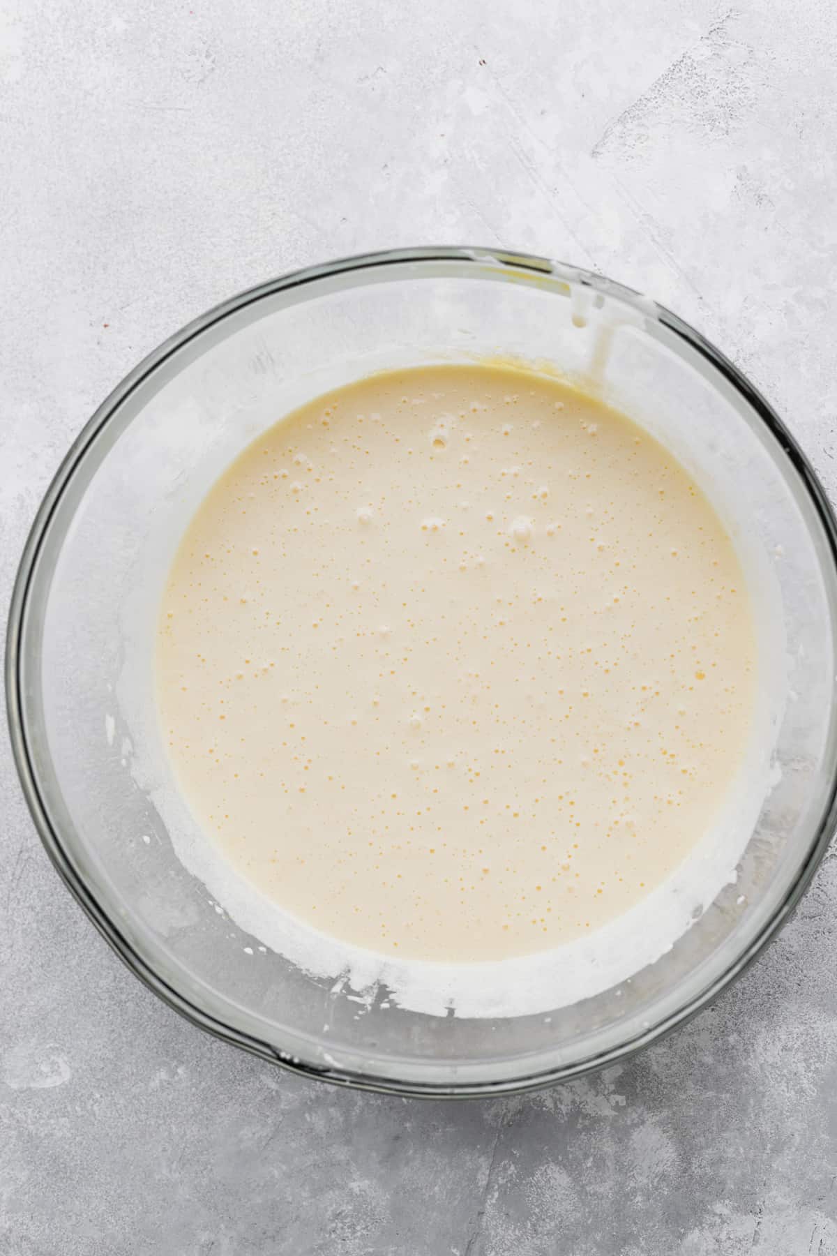 Whipped butter and sugar in a bowl.