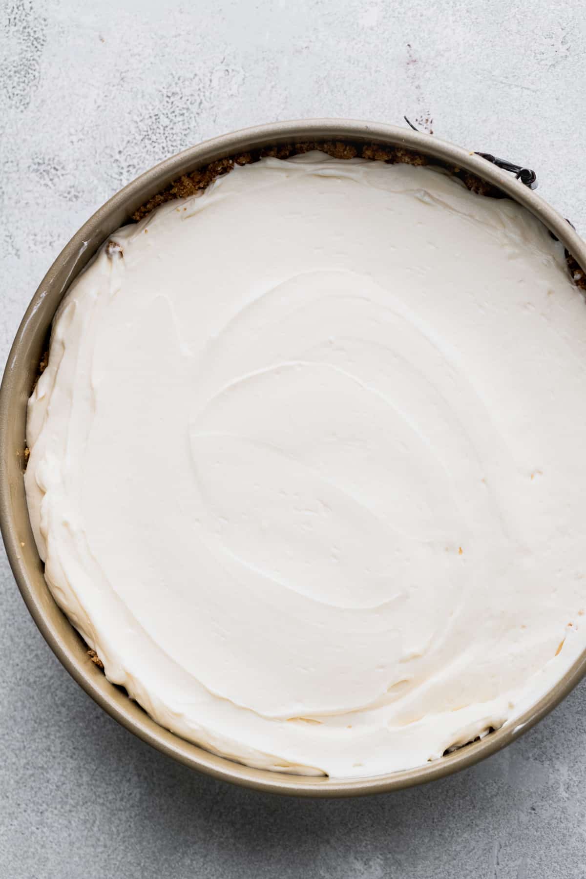 Cheesecake batter in a springform pan.