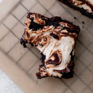 One bite missing from marshmallow brownies.