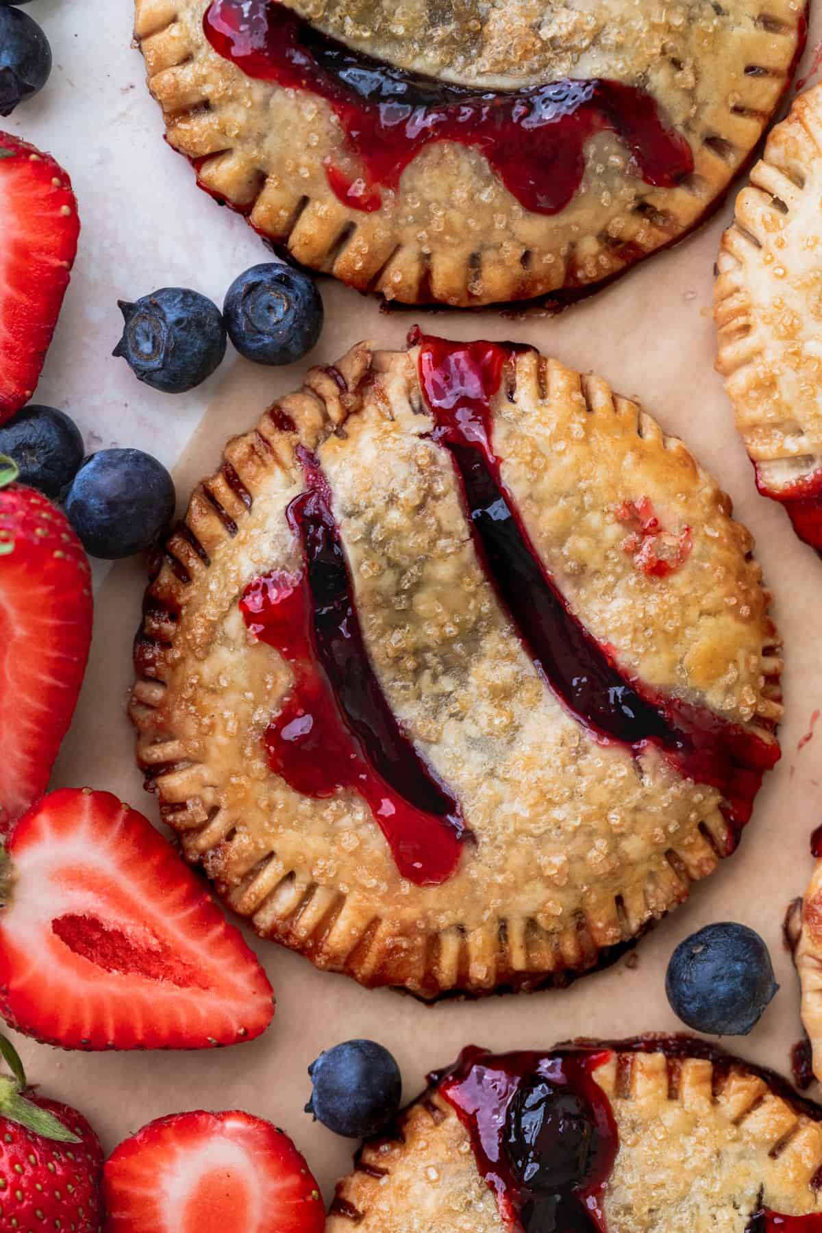 Close up of blueberry strawberry pies.