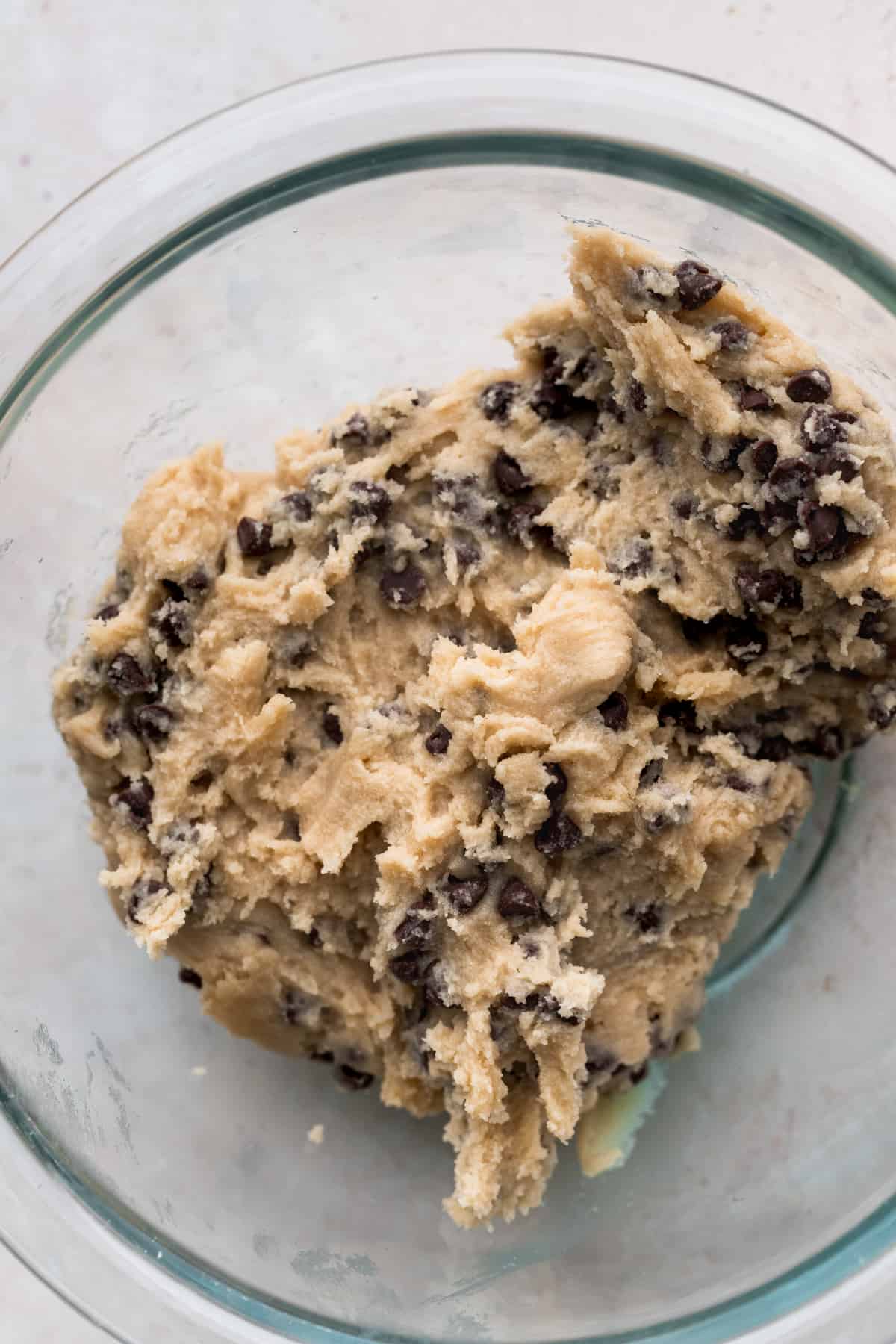 Edible cookie dough in a glass bowl.