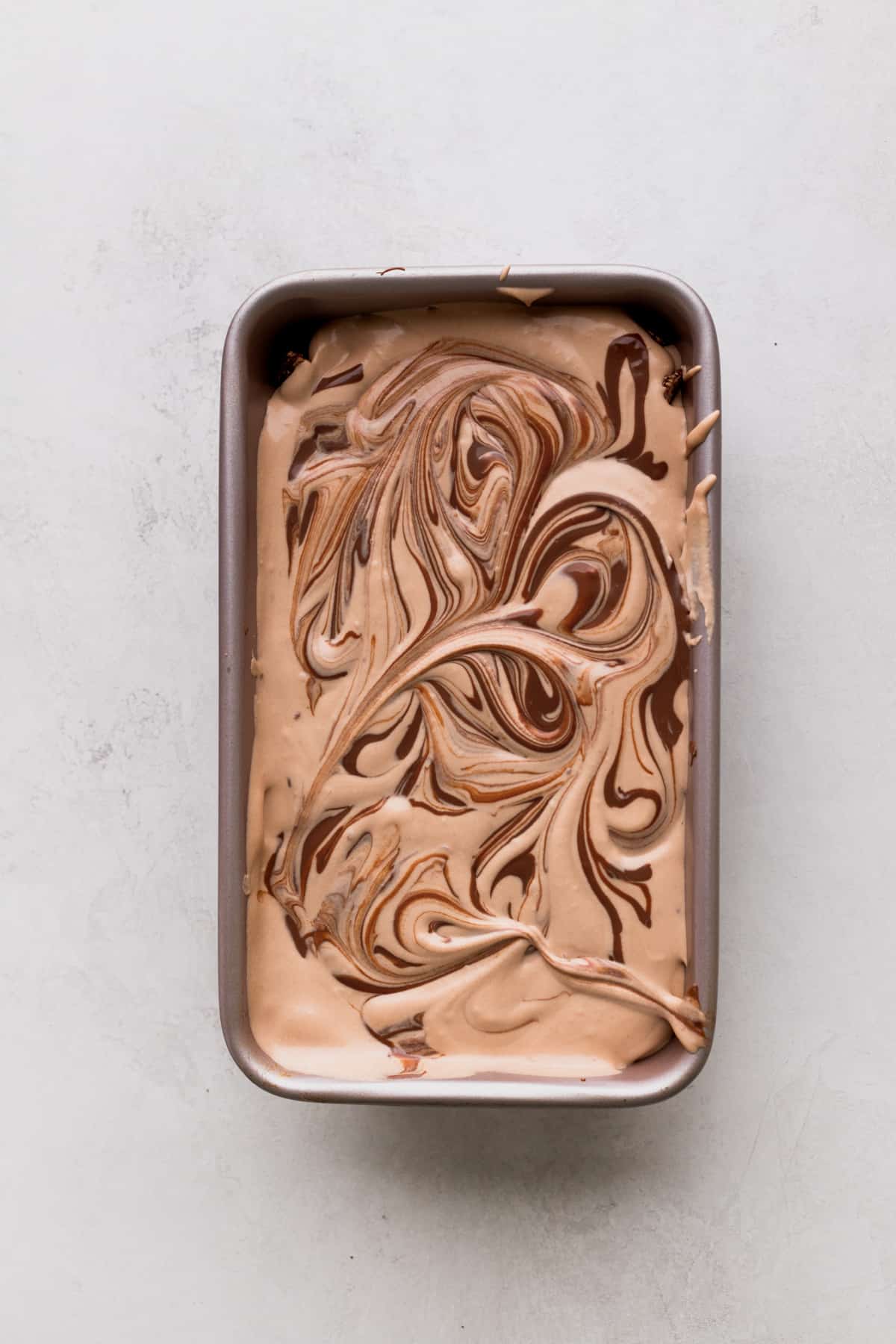 Swirled Nutella on top of ice cream.