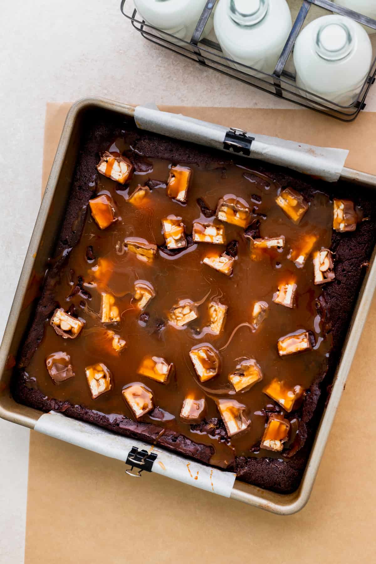 Baked brownies with caramel on top in the pan.