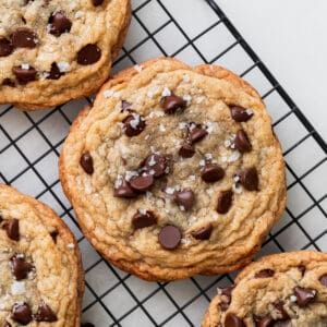 The best chocolate chip cookies on a wire rack.