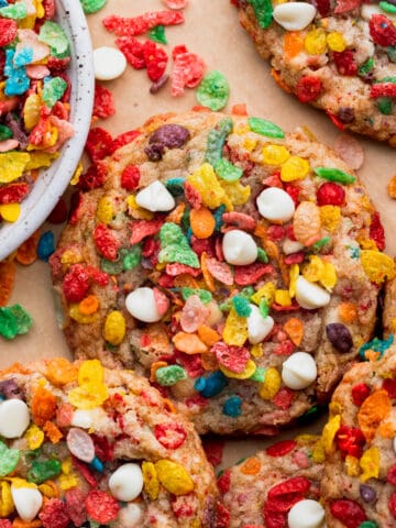 Fruity pebble cookies on parchment paper.
