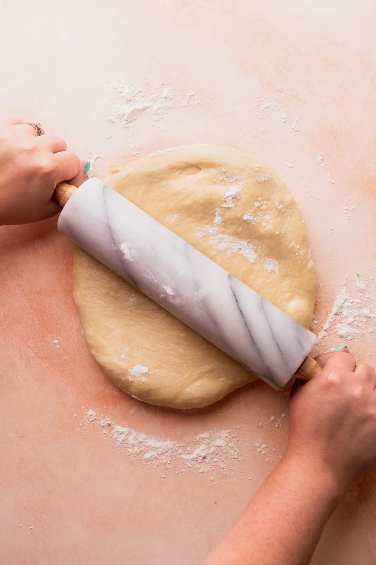 Rolling out the dough.