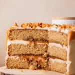 Close up of butterscotch cake on a wood board.