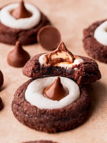 Close up of a bite of hot cocoa cookie blossoms.