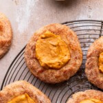 Pumpkin pie cookies on a wire rack topped with cinnamon sugar.