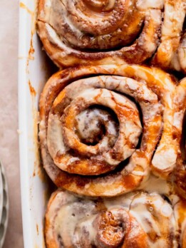 Caramel cinnamon rolls in a pan.