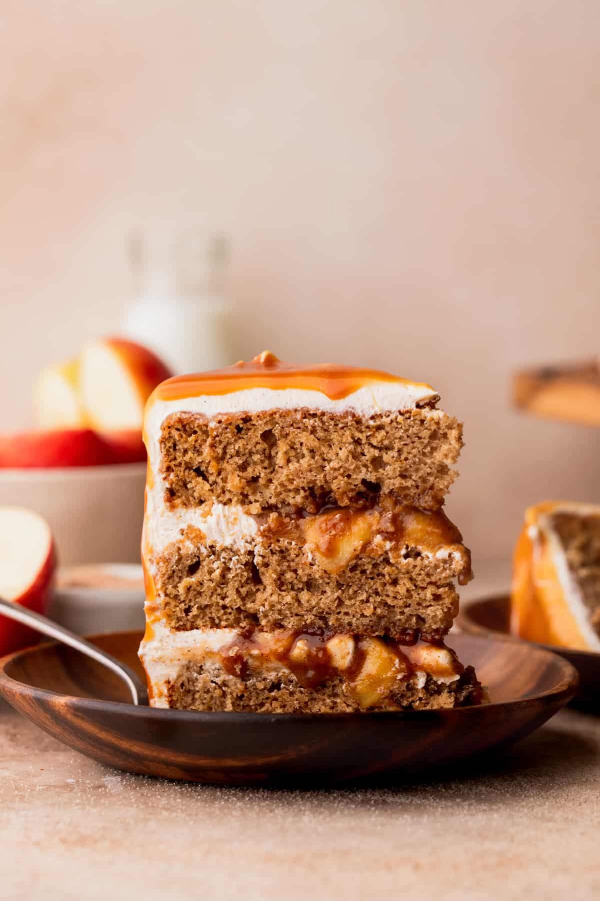 One apple cinnamon cake slice standing on the plate.