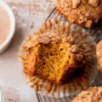 One bite missing from pumpkin banana muffins.