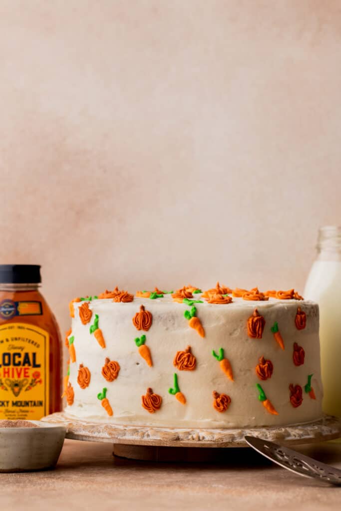 Decorated cake on a wood board.