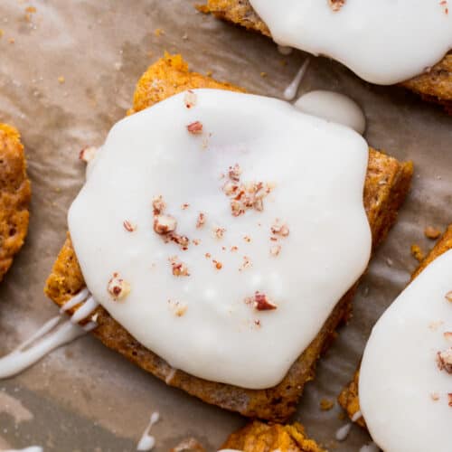 Starbucks pumpkin scone with cream cheese icing on top.