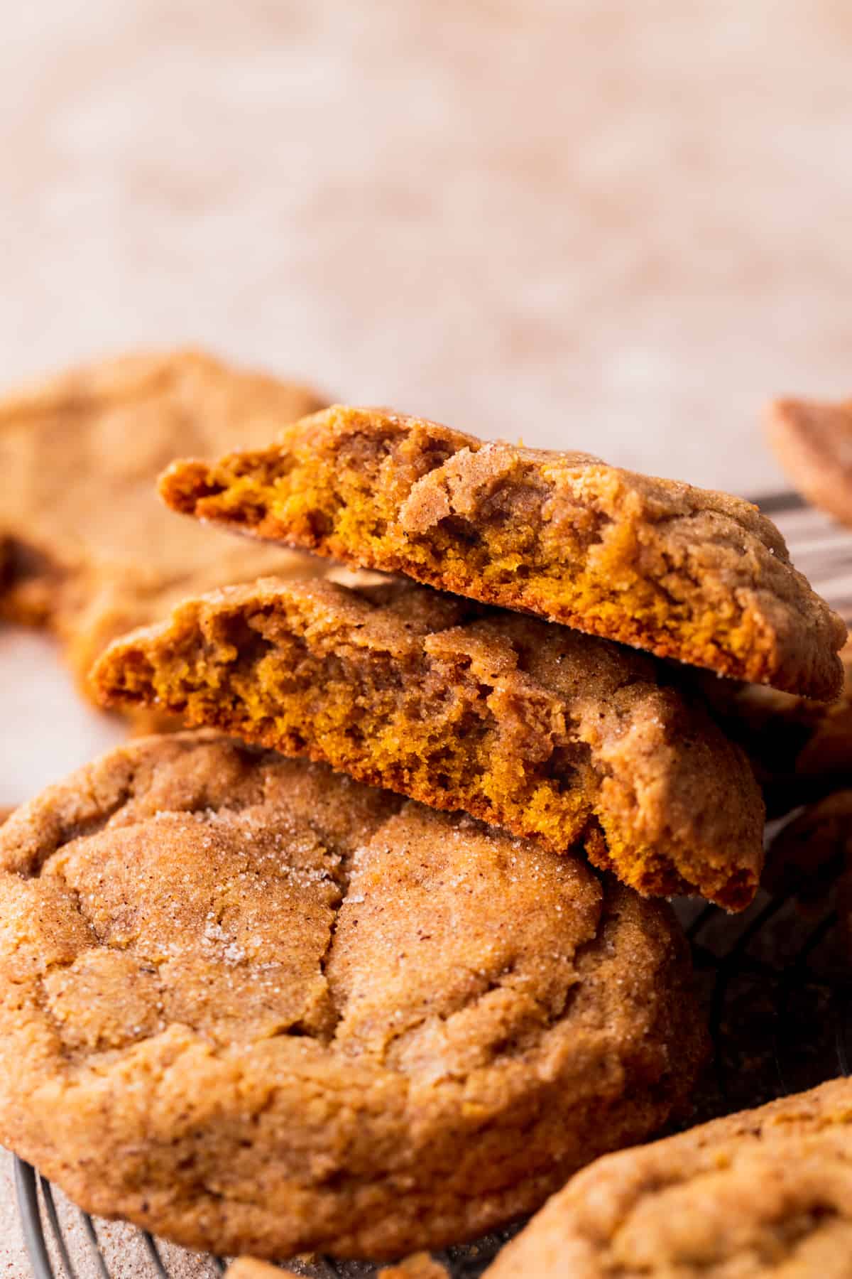 One cookie split in half on top of other cookies.