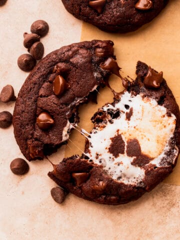 One chocolate marshmallow cookie split in half.