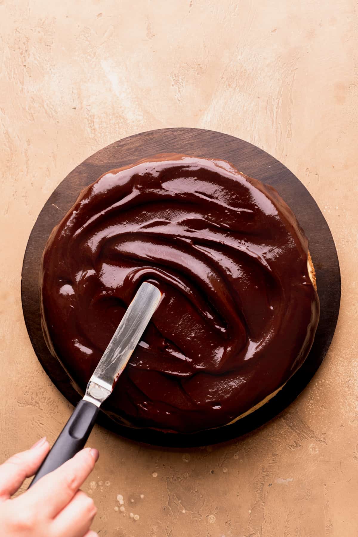 Chocolate ganache on top of cheesecake.