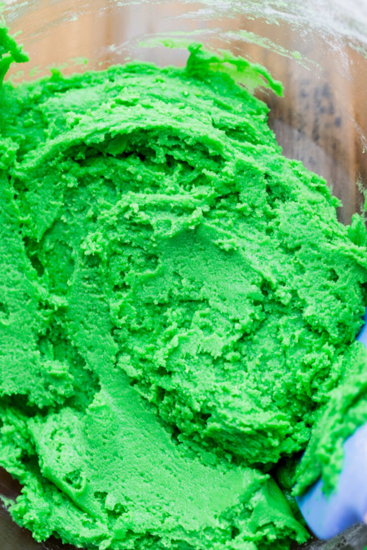 Green cookie dough in a bowl.
