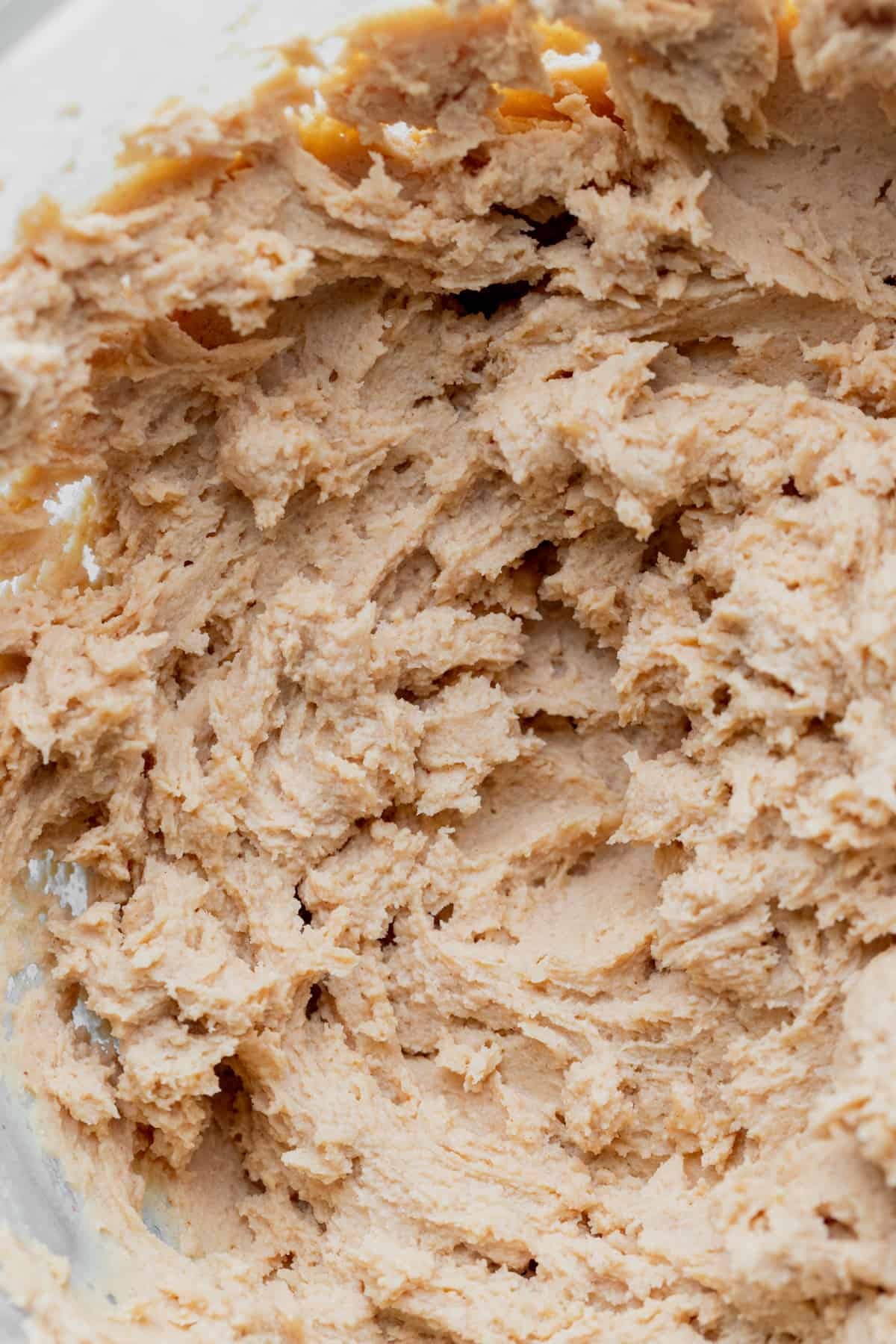 Beaten cream cheese and peanut butter in a bowl.