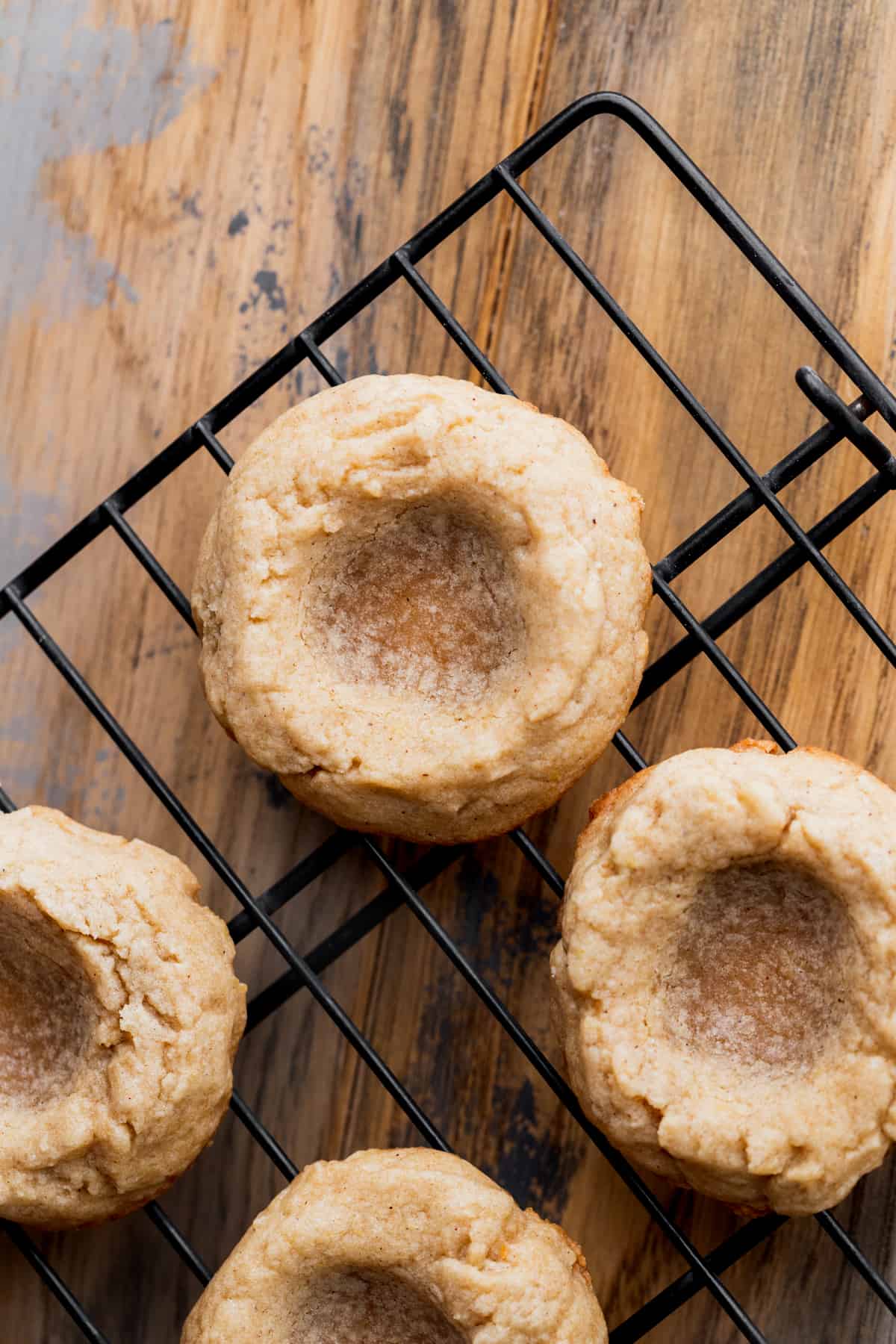 Baked cookies on a wire rack.