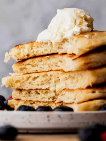 Stack of mini pancakes with them cut open.