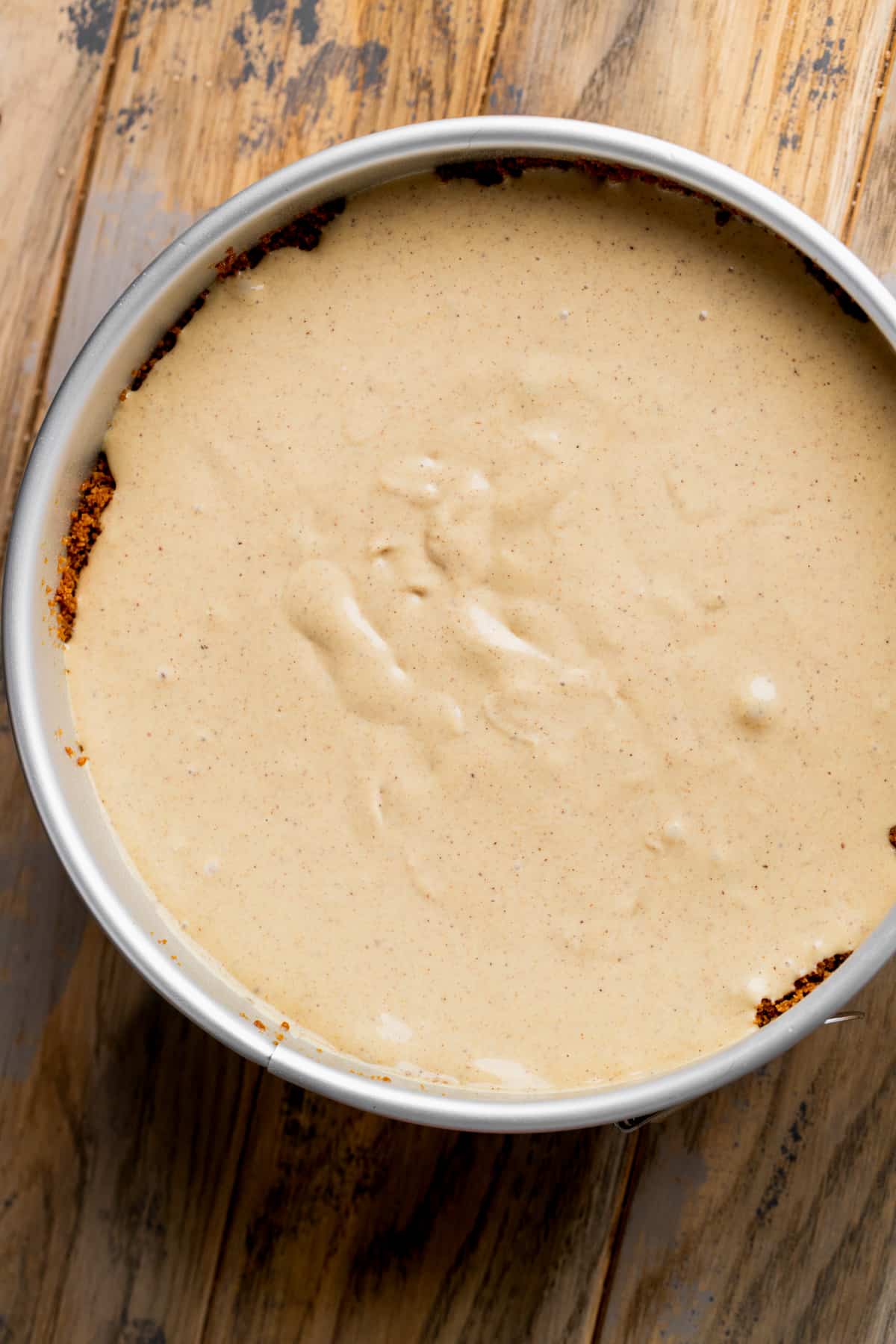 Cheesecake batter in a springform pan.