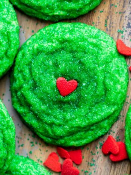 Grinch cookies with heart sprinkles.
