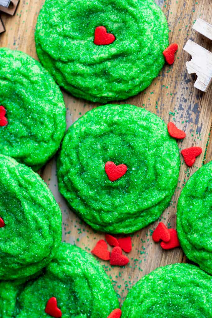 Grinch cookies with heart sprinkles.