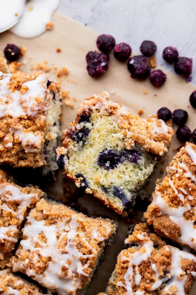 One piece of blueberry coffee cake on its side.