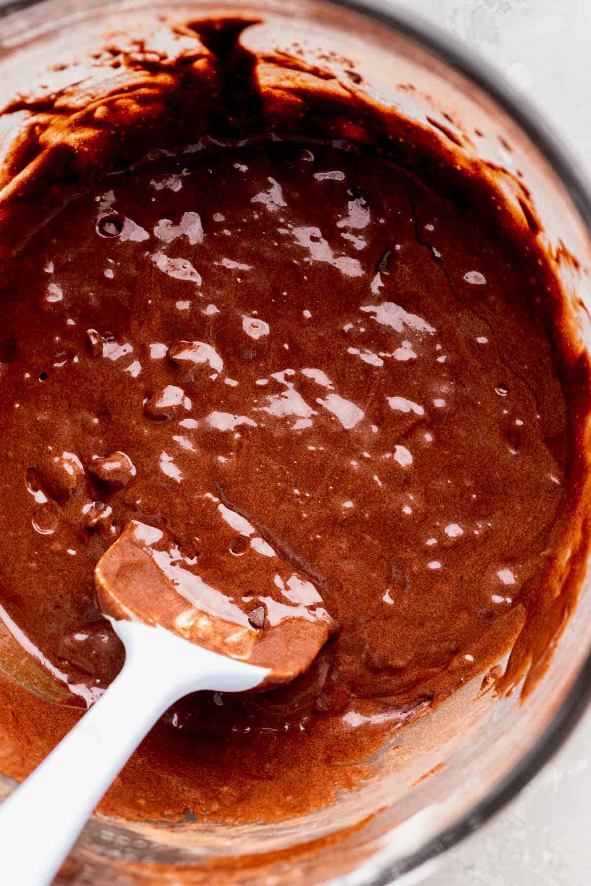 Brownie batter in a glass bowl.