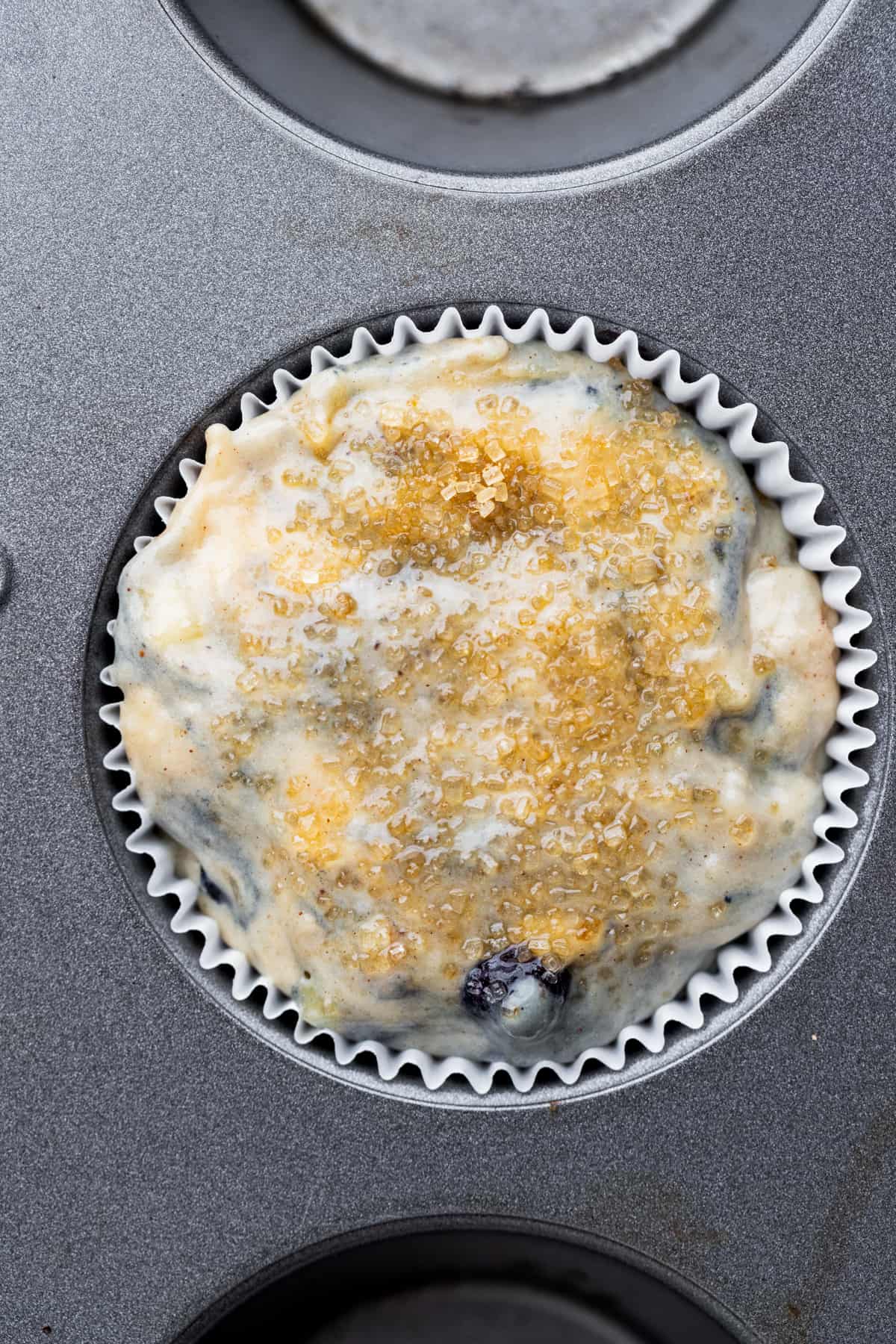 Muffin batter in a muffin pan.