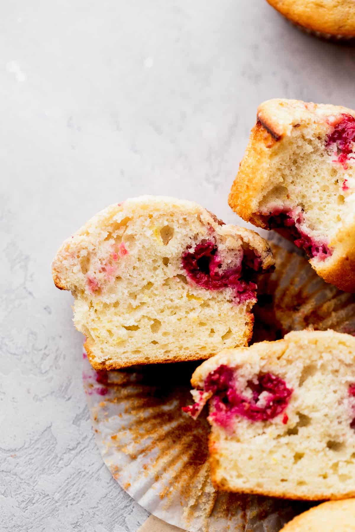 One raspberry muffin cut in half.