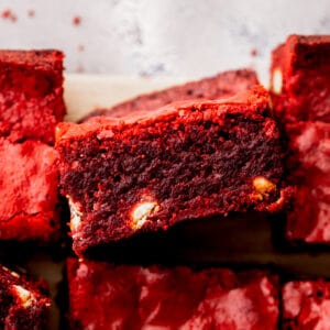 Red velvet brownies with one on its side.