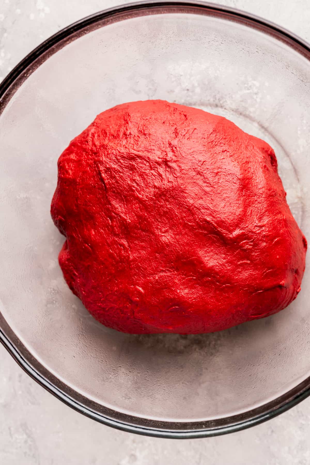 Dough in glass bowl before it rises.