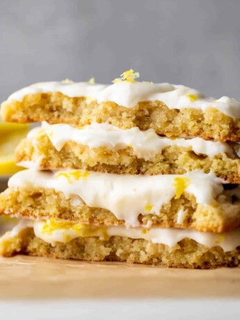 Stack of 2 lemon cookies split in half.