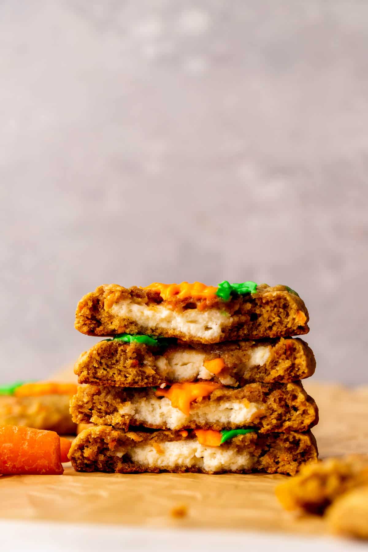 Stack of two carrot cake cookies split in half.