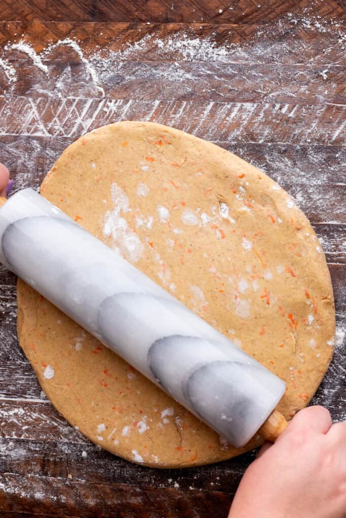 Rolling out the dough.