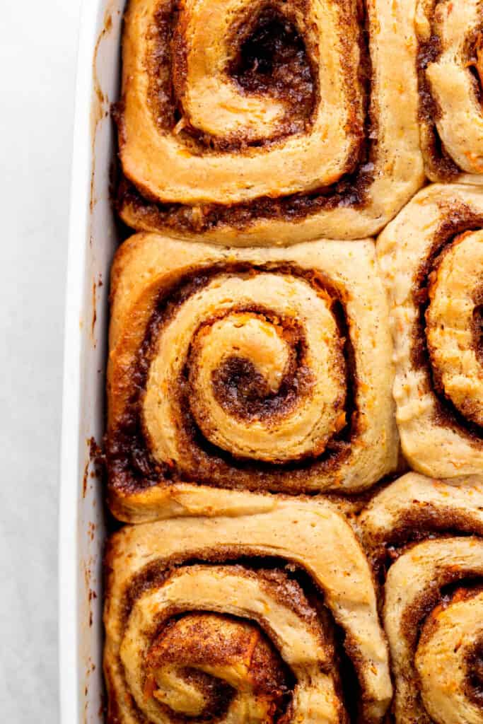 Baked cinnamon rolls in a pan.